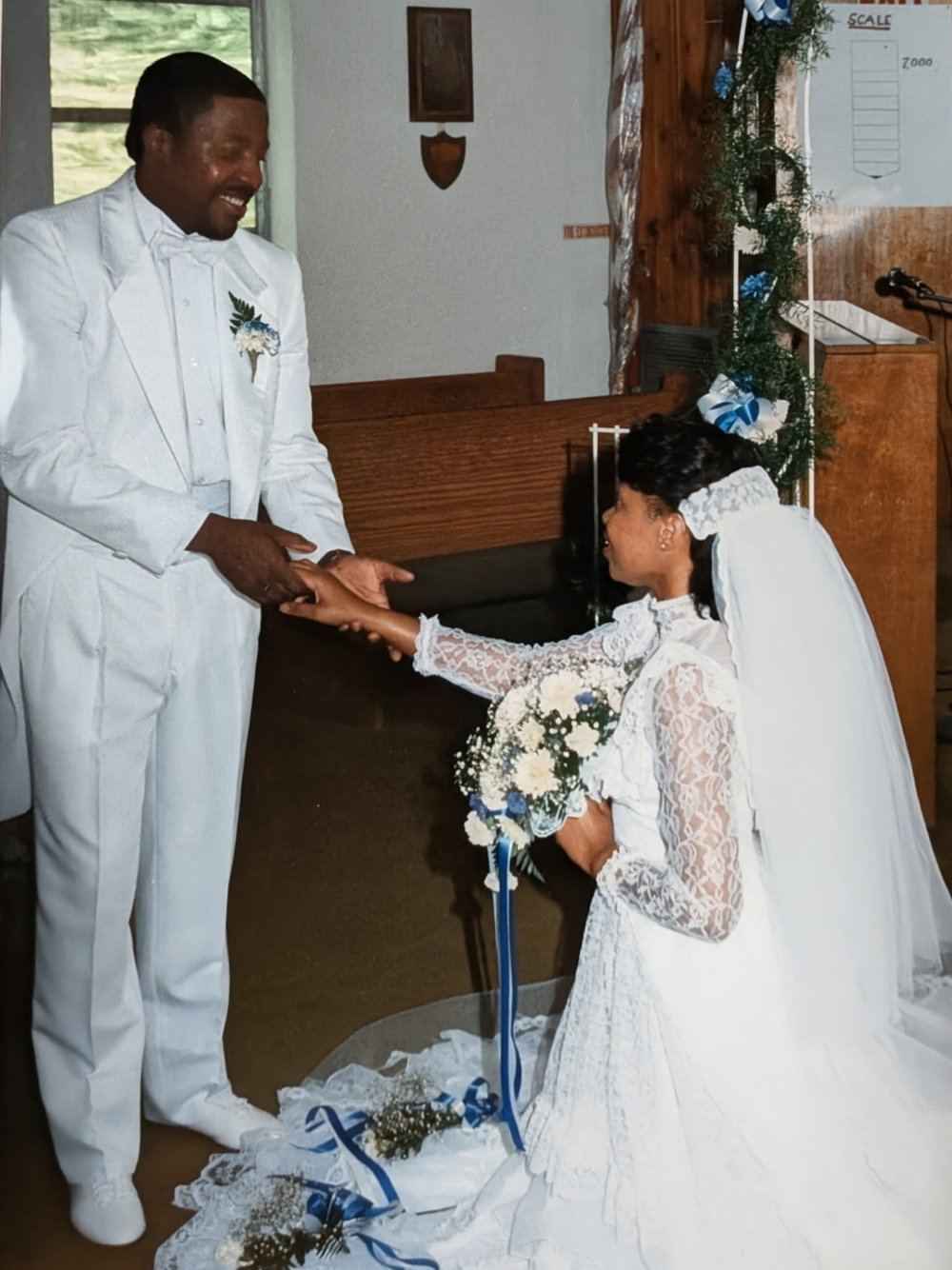 Pastor LeeArtis Nevith and First Lady Linda Nevith holding hands on their wedding day